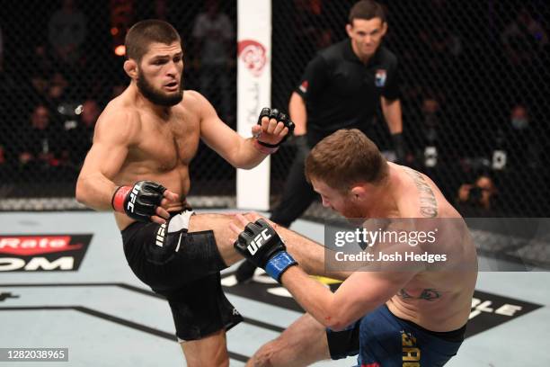 Khabib Nurmagomedov of Russia kicks Justin Gaethje in their lightweight title bout during the UFC 254 event on October 25, 2020 on UFC Fight Island,...
