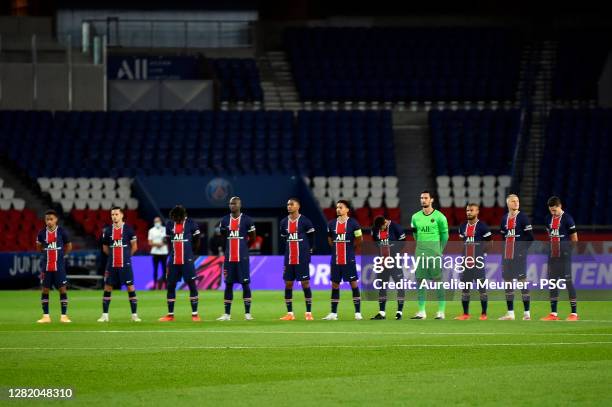 Players line up for a minute of silence in tribute of teacher Samuel Paty before the Ligue 1 match between Paris Saint-Germain and Dijon FCO at Parc...