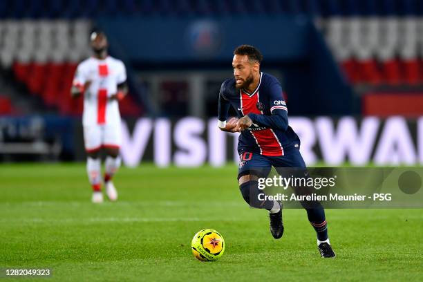 Neymar Jr of Paris Saint-Germain runs with the ball during the Ligue 1 match between Paris Saint-Germain and Dijon FCO at Parc des Princes on October...