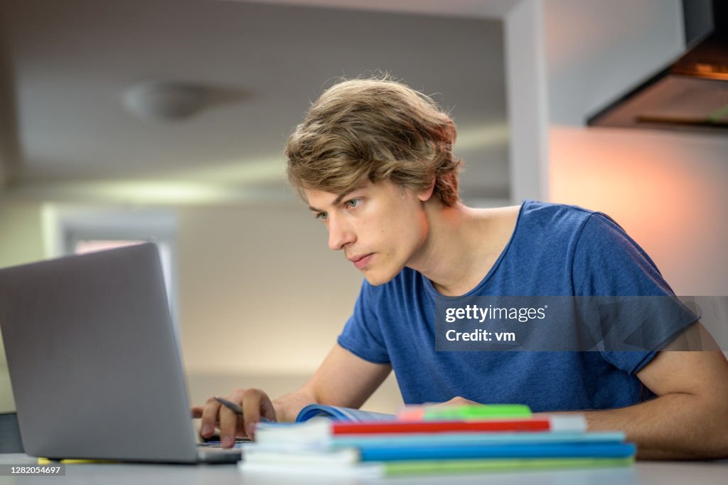 Adult Student Using Computer Young Adult Student Watching Laptop Computer Screen High-Res Stock ...