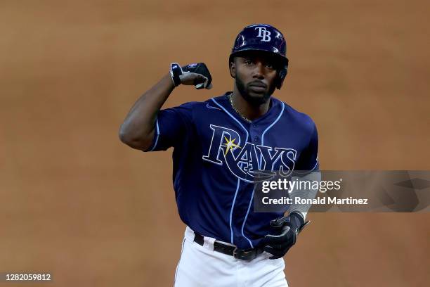 Randy Arozarena of the Tampa Bay Rays celebrates after hitting a solo home run against the Los Angeles Dodgers during the fourth inning in Game Four...