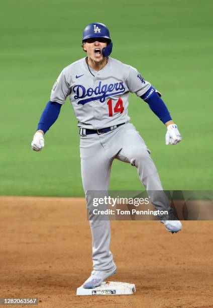 Enrique Hernandez of the Los Angeles Dodgers celebrates after hitting an RBI double against the Tampa Bay Rays during the sixth inning in Game Four...