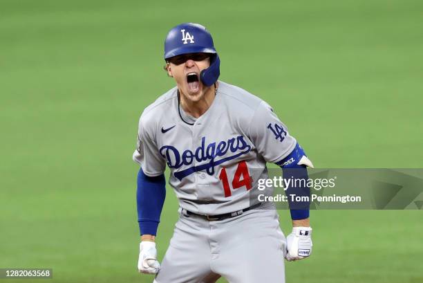Enrique Hernandez of the Los Angeles Dodgers celebrates after hitting an RBI double against the Tampa Bay Rays during the sixth inning in Game Four...