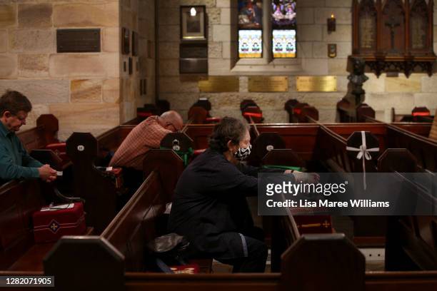 Parishioners pray during the 'Twenty-First Sunday after Pentecost' service with Father James Collins at St Paul's Anglican Church in Burwood on...