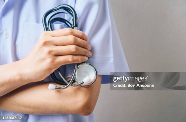 cropped shot of healthcare worker holding a stethoscope. - phonendoscope stock pictures, royalty-free photos & images