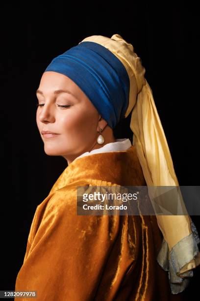 studio portrait of a girl with a pearl earring - renaissance stock pictures, royalty-free photos & images