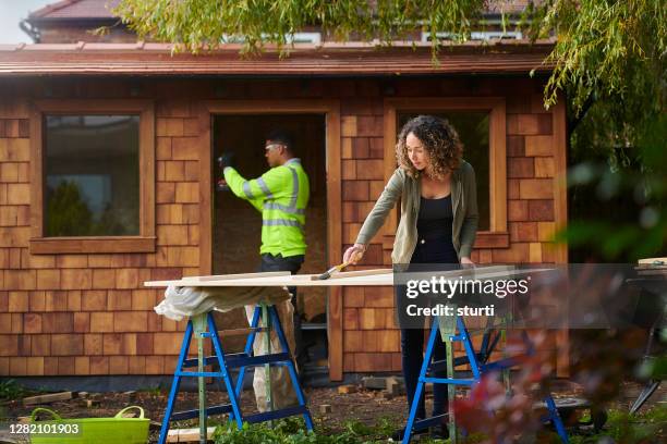 building the garden cabin - wood shed stock pictures, royalty-free photos & images