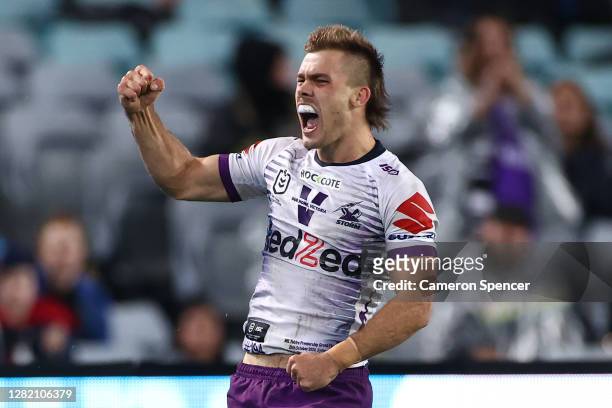 Ryan Papenhuyzen of the Storm celebrates scoring a try during the 2020 NRL Grand Final match between the Penrith Panthers and the Melbourne Storm at...
