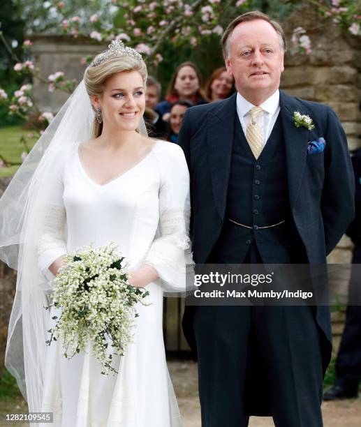 Laura Parker Bowles accompanied by her father Andrew Parker Bowles arrives for her wedding to Harry Lopes at St Cyriac's Church on May 6, 2006 in...