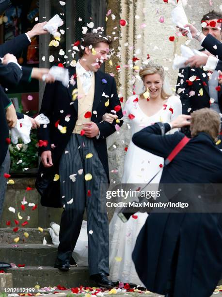 Harry Lopes and Laura Parker Bowles are showered in confetti as they depart after their wedding at St Cyriac's Church on May 6, 2006 in Lacock,...