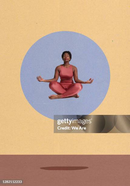 woman meditating sitting crosslegged - lotuspositie stockfoto's en -beelden