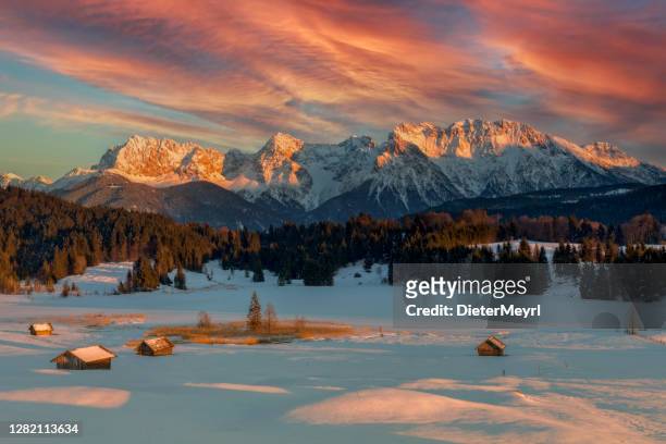 magic sunrise at alpine lake geroldsee - view to mount karwendel, garmisch partenkirchen - karwendel stock pictures, royalty-free photos & images