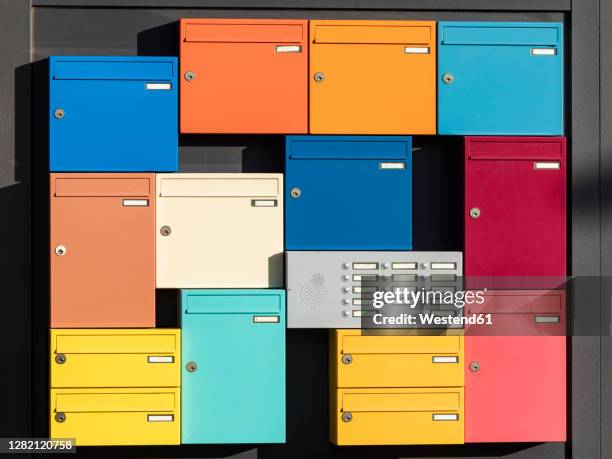 apartment intercom surrounded by colorful mailboxes - various angles stock pictures, royalty-free photos & images