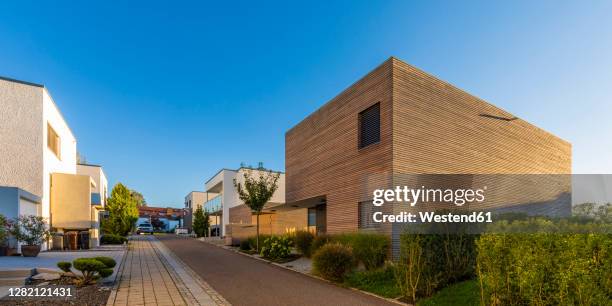 germany, baden-wurttemberg, esslingen, energy efficient houses in modern suburb - housing development road stock pictures, royalty-free photos & images