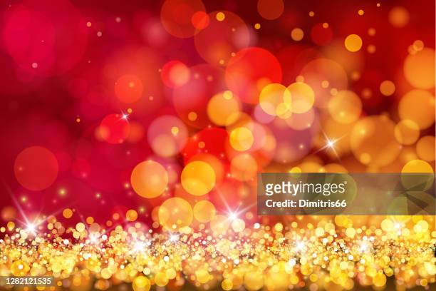 abstract christmas red and gold glitter bokeh background - bokeh love stock illustrations
