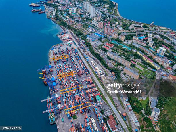 russia, primorsky krai, vladivostok, aerial view of commercial dock on shore of sea of japan - vladivostok city stock pictures, royalty-free photos & images