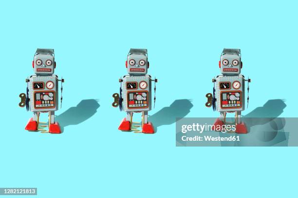 studio shot of three vintage robot toys - wind up toy imagens e fotografias de stock