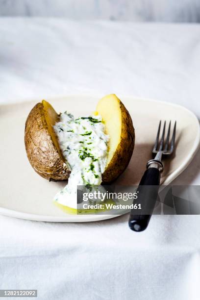 baked potato with herb quark and homemade ramsonoil - curd cheese stock pictures, royalty-free photos & images