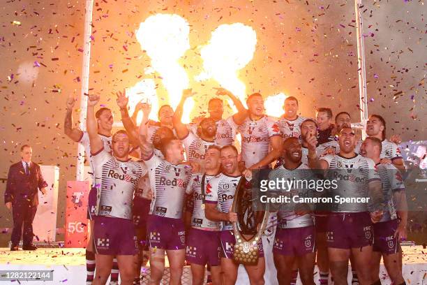 Cameron Smith of the Storm holds aloft the Premiership trophy and celebrates with team mates after winning the 2020 NRL Grand Final match between the...