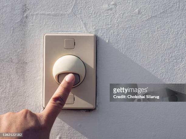 hand press on buzzer,finger of man pressing doorbell - finger ring stock pictures, royalty-free photos & images