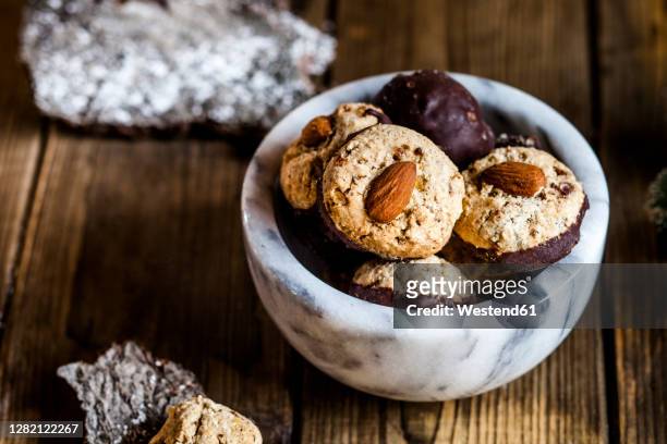 bowl ofgingerbread cookies with almonds - almond cookies stock pictures, royalty-free photos & images