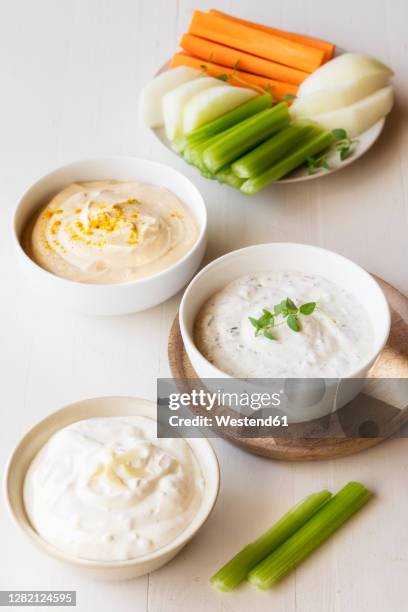 variation of sour cream with vegetable stick kept on table - salsa espesa fotografías e imágenes de stock
