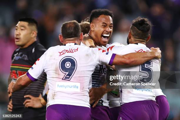 Felise Kaufusi of the Storm celebrates with Josh Addo-Carr and Cameron Smith of the Storm after the final siren, winning the 2020 NRL Grand Final...