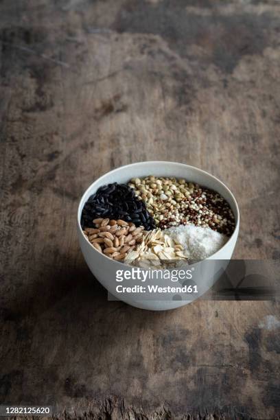 bowl with different types of grains - buckwheat stock pictures, royalty-free photos & images