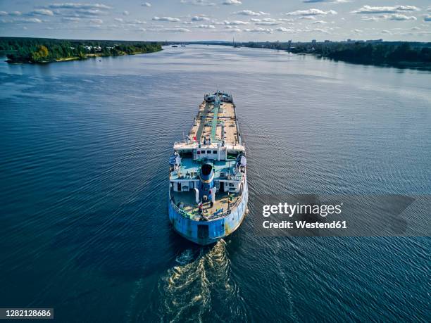 oil tanker on volga river against sky - oil tanker imagens e fotografias de stock