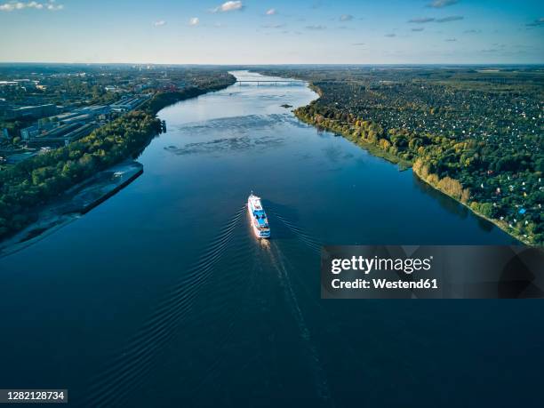 ship moving on volga river against sky - volga stockfoto's en -beelden