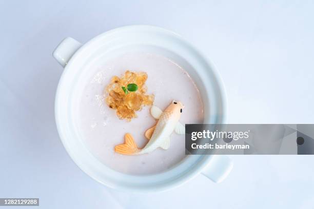 close to the dessert shaped like a fish in chinese restaurant - celery soup stock pictures, royalty-free photos & images