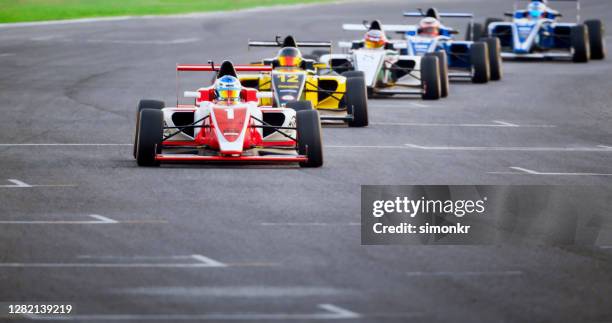 drivers driving racing cars - autosport circuit stock pictures, royalty-free photos & images