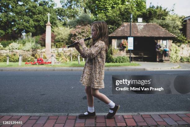 girl playing recorder - flauto dolce foto e immagini stock