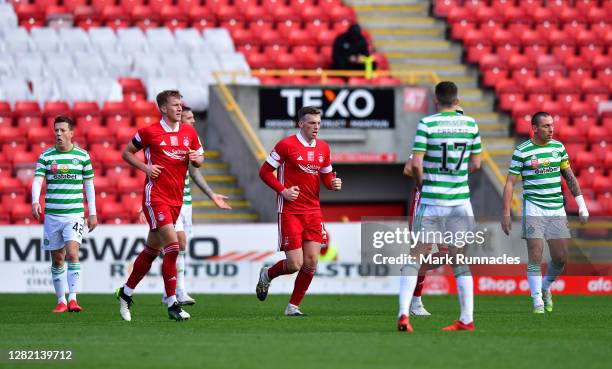 Lewis Ferguson of Aberdeen celebrates after scoring his team's third goal from a penalty during the Ladbrokes Scottish Premiership match between...