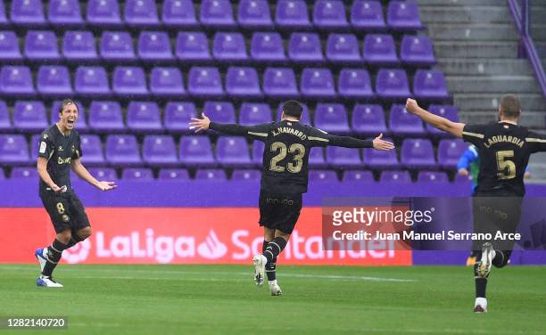 Tomas Pina of Deportivo Alaves celebrates with team mates Ximo Navarro and Victor Laguardia after scoring his sides first goal during the La Liga...