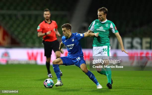 Christoph Baumgartner of TSG 1899 Hoffenheim battles for possession with Christian Gross of Werder Bremen during the Bundesliga match between SV...