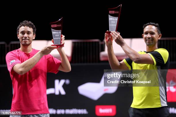 Ben McLachlan of Japan and Raven Klaasen of South Africa pose with the winning trophy on the podium after winning the double final match between...