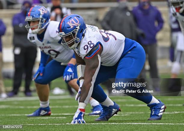 Defensive lineman Caleb Sampson of the Kansas Jayhawks gets set on the line during the second half against the Kansas State Wildcats at Bill Snyder...