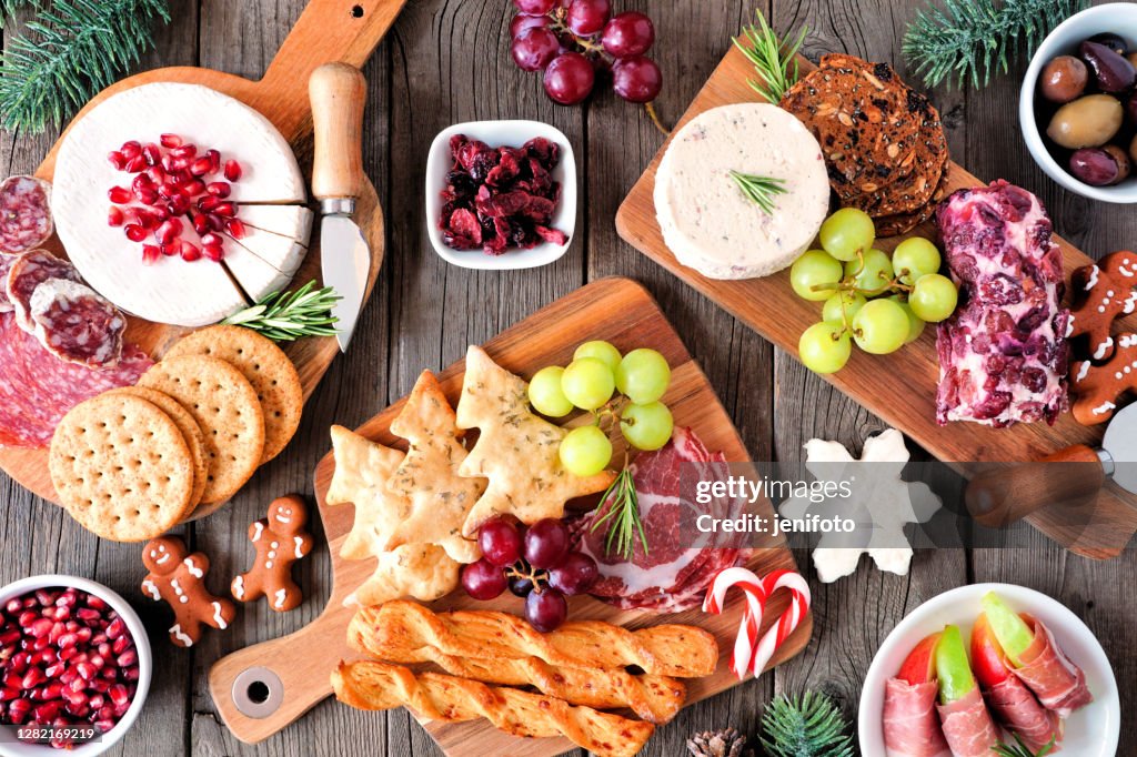 Christmas theme charcuterie top view table scene against dark wood