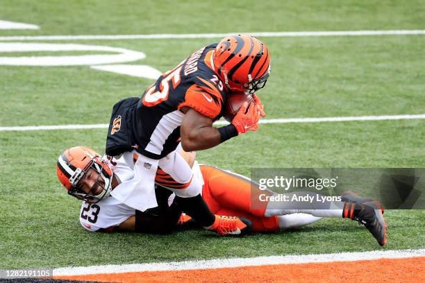 Giovani Bernard of the Cincinnati Bengals scores a touchdown against Andrew Sendejo of the Cleveland Browns during the second half at Paul Brown...