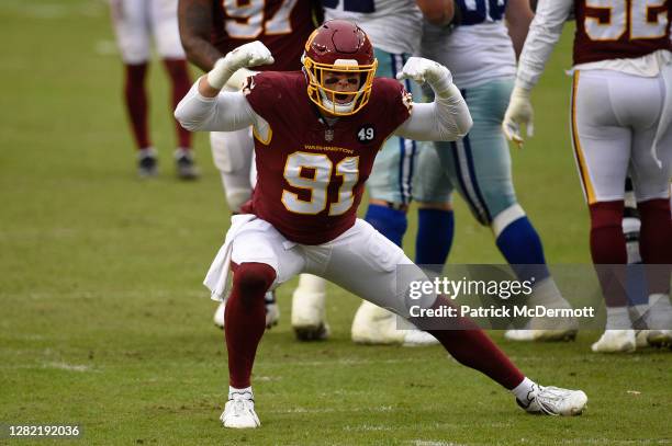 Ryan Kerrigan of the Washington Football Team celebrates his sack against quarterback Ben DiNucci , of the Dallas Cowboys at FedExField on October...