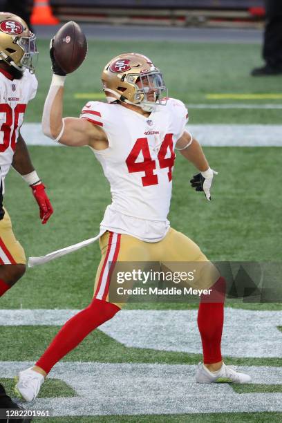 Kyle Juszczyk of the San Francisco 49ers celebrates his touchdown against the New England Patriots during their NFL game at Gillette Stadium on...