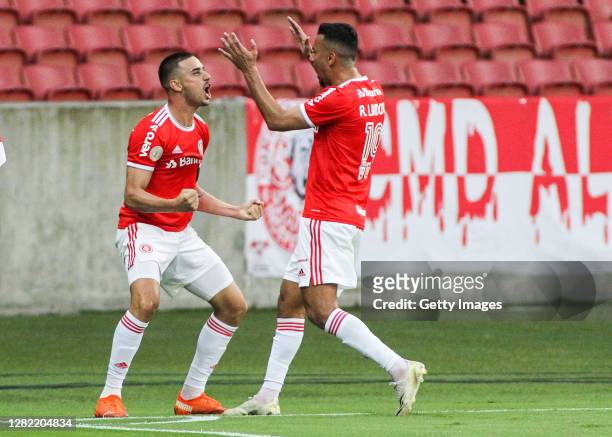 Thiago Galhardo of Internacional celebrates with teammate Rodrigo Lindoso after scoring the second goal of their team during the match against...