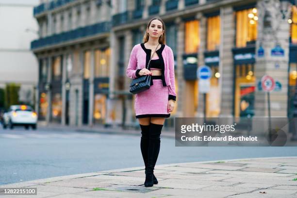 Maria Rosaria Rizzo wears a golden necklace, a pink and black corduroy open jacket from Cheyma, black and pink bras, a pink corduroy Cheyma short...