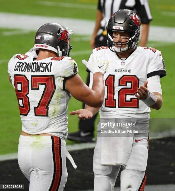 Tight end Rob Gronkowski and quarterback Tom Brady of the Tampa Bay Buccaneers celebrate in the end zone after the team scored a touchdown against...