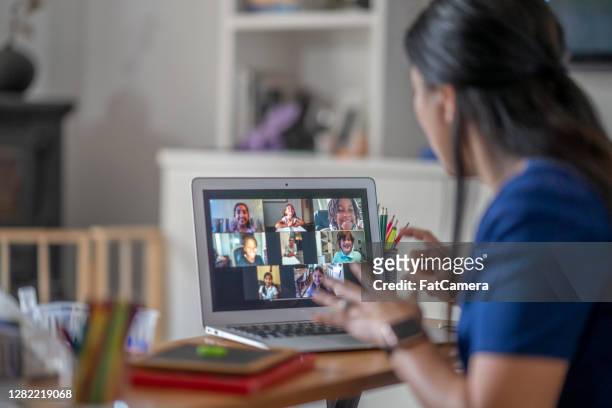 teacher teaching remotely - online instructor stock pictures, royalty-free photos & images