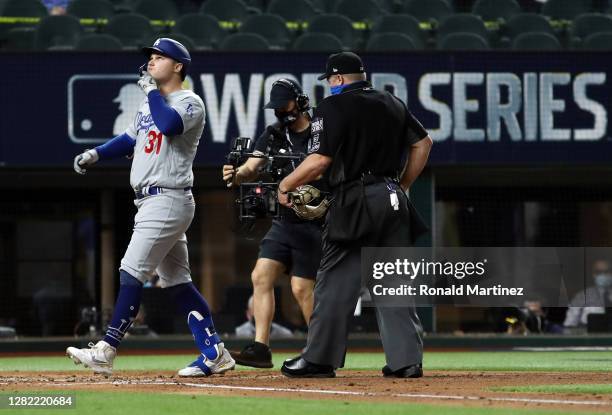 Joc Pederson of the Los Angeles Dodgers crosses home plate after hitting a solo home run against the Tampa Bay Rays during the first inning in Game...