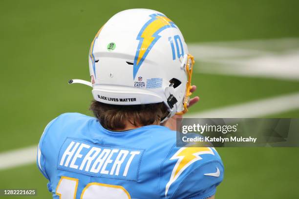 Detailed view of a helmet worn by quarterback Justin Herbert of the Los Angeles Chargers reads "Black Lives Matter" as they take on the Jacksonville...