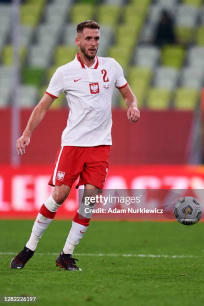 Pawel Bochniewicz from Poland controls the ball during the international friendly match between Poland and Finland at Energa Stadium on October 7,...