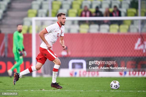 Pawel Bochniewicz from Poland controls the ball during the international friendly match between Poland and Finland at Energa Stadium on October 7,...